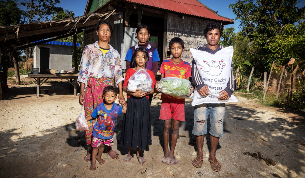 A family outside their home in Cambodia.
