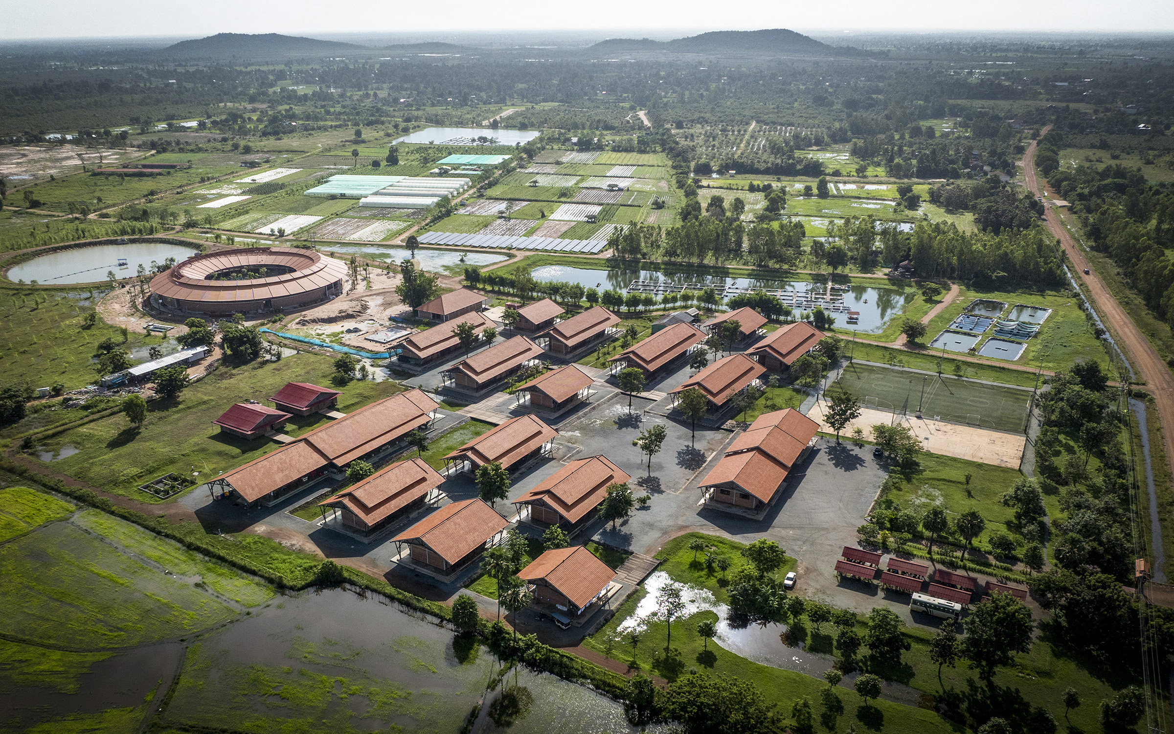 Aerial view of the campus with the new circular school building.