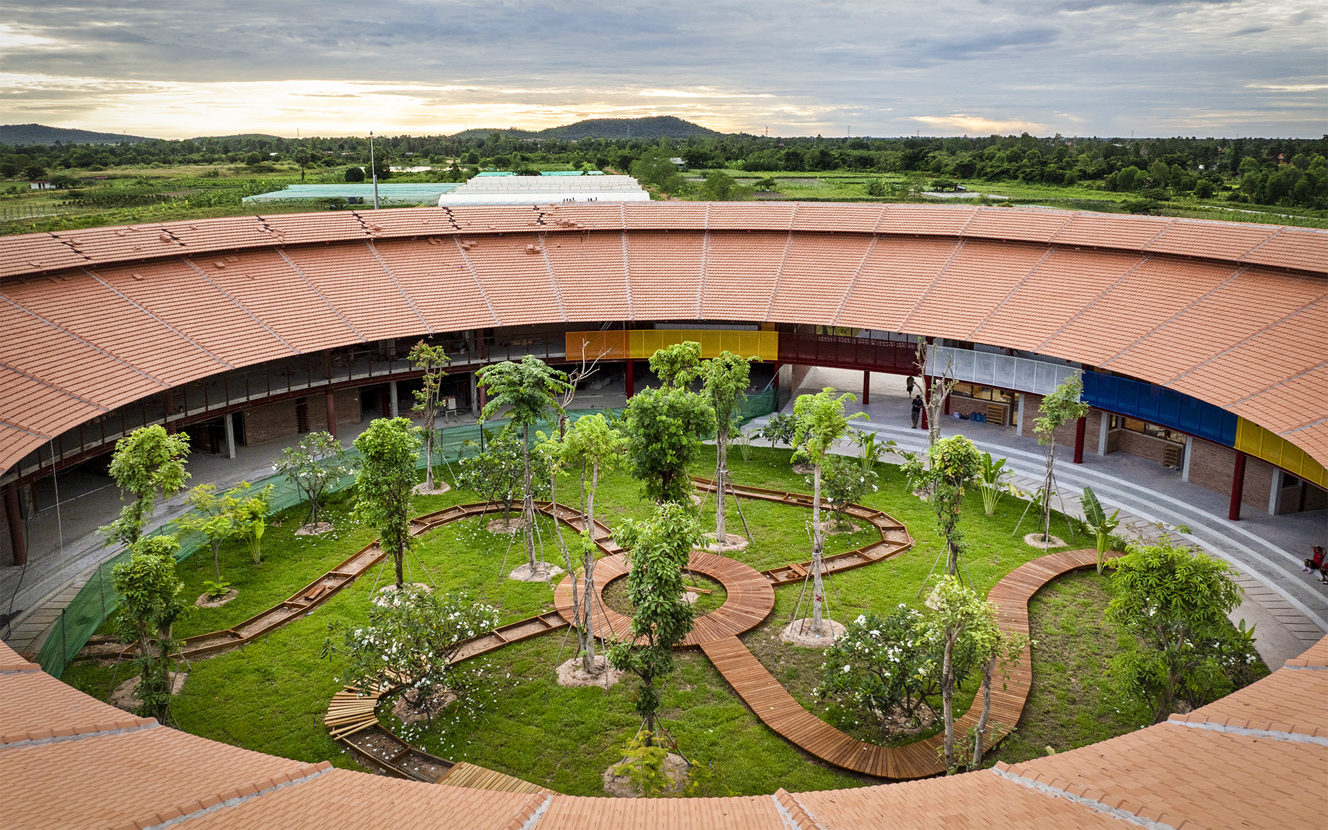 View into the planted courtyard of the circular school building.