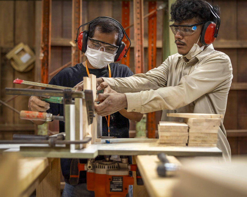 Instruction at a woodworking machine.